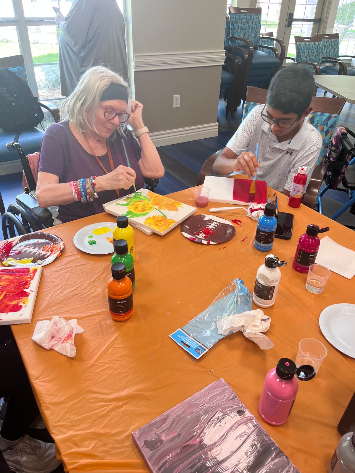 GrandPals volunteer sharing a joyful moment with a senior